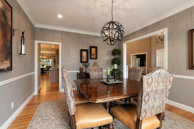 2539 S Forrest Heights Ave, Springfield, MO 65809 - dining space featuring a chandelier, light wood-type flooring, crown molding, wallpapered walls, and baseboards