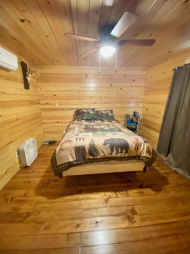 213 Spring Lake Dr, Mammoth Spring, AR 72554 - bedroom featuring wood ceiling, wood walls, wood-type flooring, and a ceiling fan