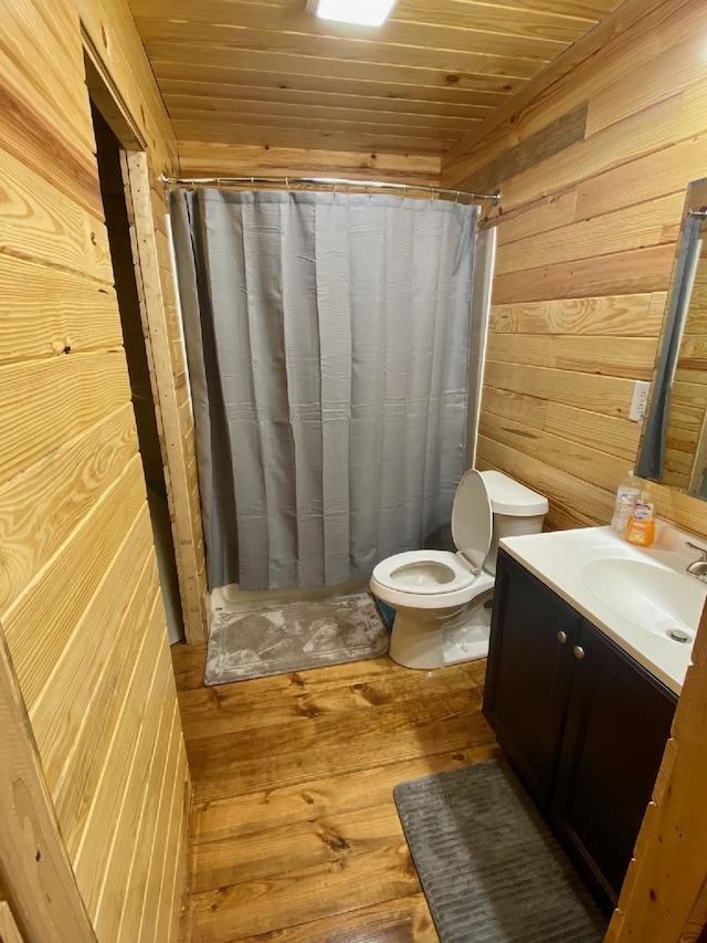 213 Spring Lake Dr, Mammoth Spring, AR 72554 - bathroom featuring wood walls, vanity, toilet, hardwood / wood-style floors, and wood ceiling