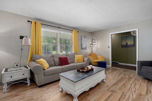 1511 E University St, Springfield, MO 65804 - living room featuring light wood-type flooring and baseboards