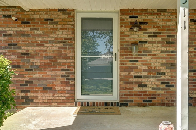 1511 E University St, Springfield, MO 65804 - doorway to property featuring brick siding
