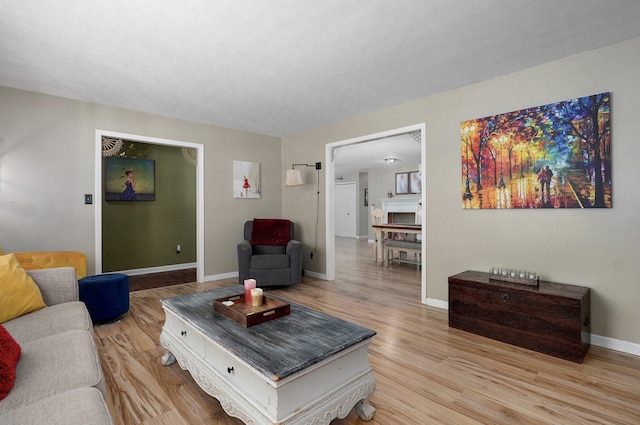 1511 E University St, Springfield, MO 65804 - living room featuring light wood-style floors and baseboards