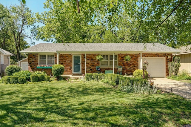 1511 E University St, Springfield, MO 65804 - ranch-style home with a garage, a front yard, driveway, and brick siding