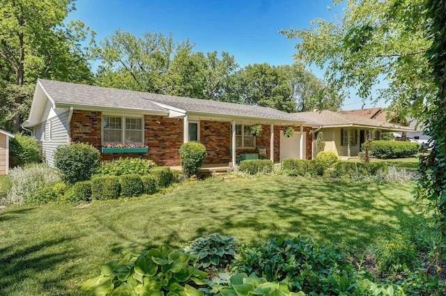 1511 E University St, Springfield, MO 65804 - ranch-style house with an attached garage, a front yard, and brick siding