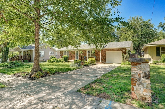 1511 E University St, Springfield, MO 65804 - single story home featuring an attached garage, driveway, a front yard, and brick siding