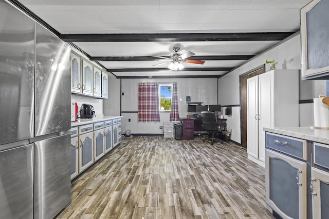 5680 N Farm Rd Unit 215, Strafford, MO 65757 - kitchen featuring freestanding refrigerator, light wood-style floors, a desk, light countertops, and ceiling fan