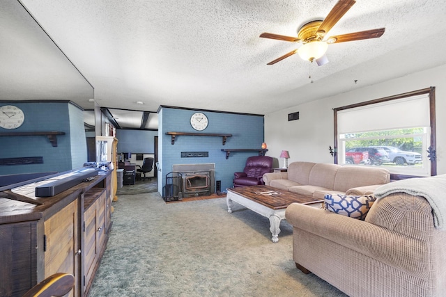 5680 N Farm Rd Unit 215, Strafford, MO 65757 - living area with a ceiling fan, a textured ceiling, carpet, and a wood stove