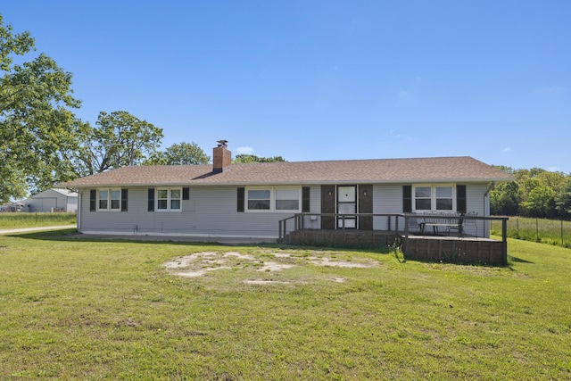 5680 N Farm Rd Unit 215, Strafford, MO 65757 - rear view of property with a chimney and a lawn