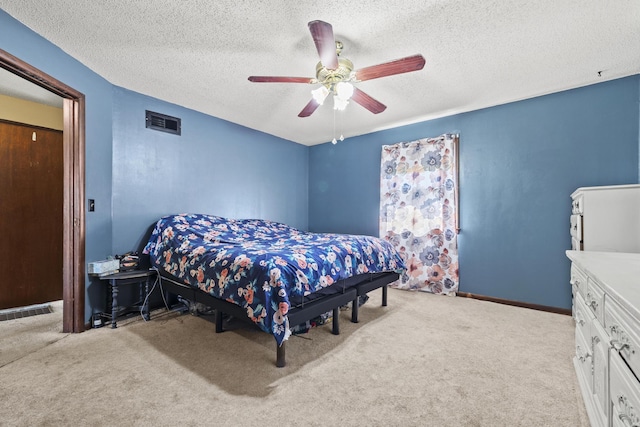 5680 N Farm Rd Unit 215, Strafford, MO 65757 - bedroom featuring carpet flooring, a textured ceiling, a ceiling fan, and baseboards