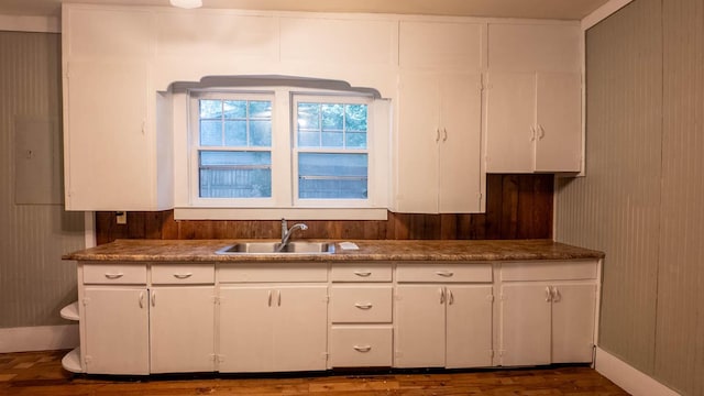 222 Poplar St, Thayer, MO 65791 - kitchen featuring a sink, white cabinetry, dark wood-style flooring, and baseboards