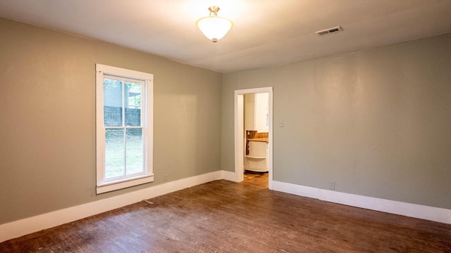 222 Poplar St, Thayer, MO 65791 - spare room featuring wood finished floors and baseboards