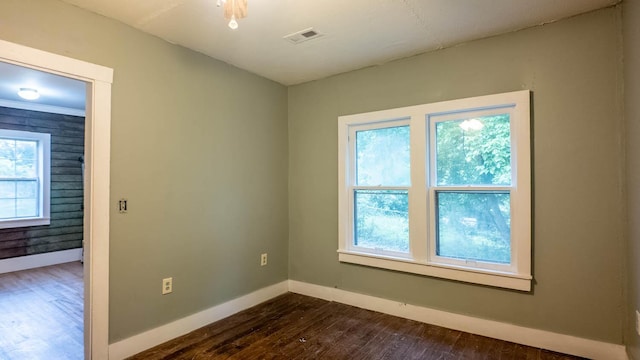 222 Poplar St, Thayer, MO 65791 - unfurnished room with dark wood-type flooring and baseboards