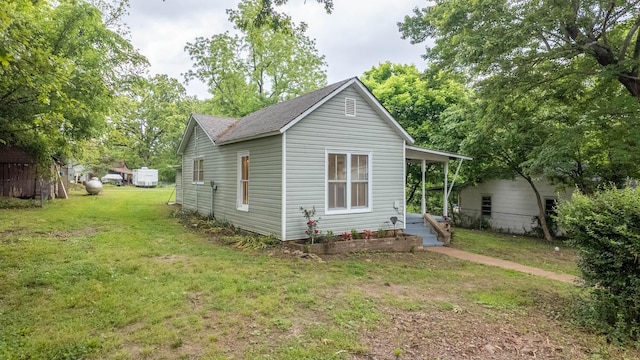 222 Poplar St, Thayer, MO 65791 - back of house with a yard and roof with shingles