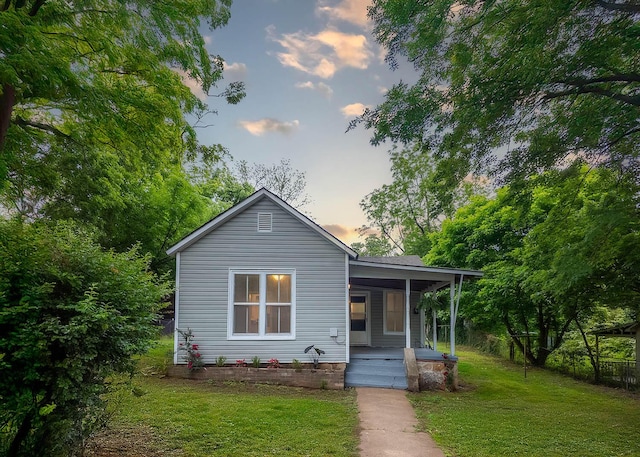 222 Poplar St, Thayer, MO 65791 - view of front of home with covered porch and a yard