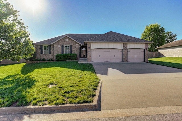1208 S Jaylin Ave, Springfield, MO 65802 - single story home featuring an attached garage, driveway, a front yard, and brick siding