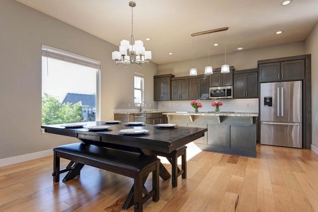 622 N Rockingham Ave, Nixa, MO 65714 - dining room featuring recessed lighting, light wood-style floors, a chandelier, and baseboards