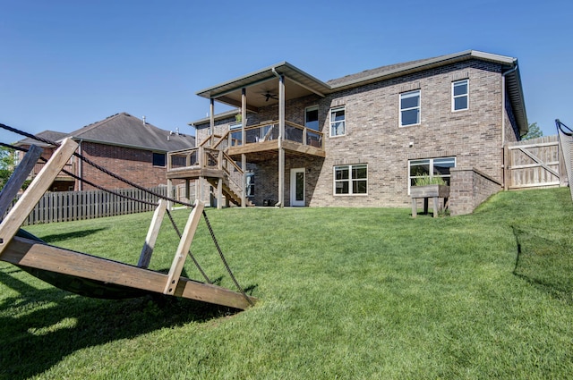 622 N Rockingham Ave, Nixa, MO 65714 - rear view of house featuring a ceiling fan, brick siding, a wooden deck, and stairway