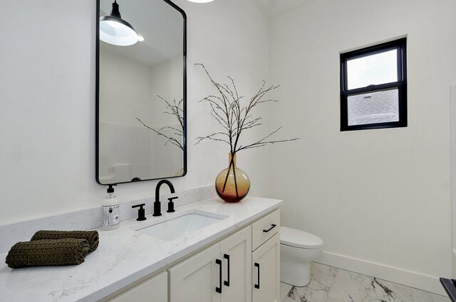1744 E Cobblestone Dr, Ozark, MO 65721 - bathroom featuring marble look tile flooring, vanity, toilet, and baseboards
