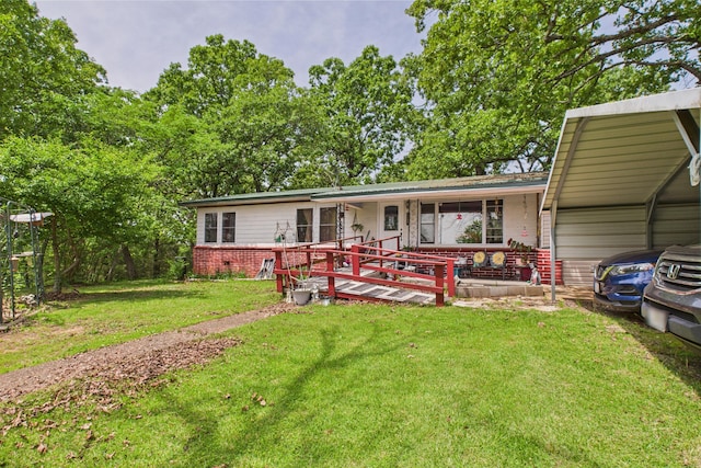 8385 Sate Highway 5, Gainesville, MO 65655 - view of front of home with brick siding, a carport, and a front yard