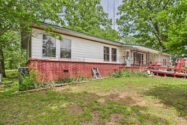 8385 Sate Highway 5, Gainesville, MO 65655 - back of house featuring a wooden deck, brick siding, and a yard