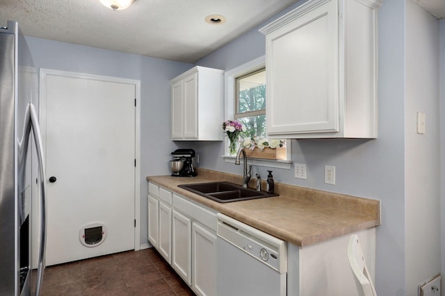 1141 N Hilton Ave, Springfield, MO 65803 - kitchen featuring dishwasher, a sink, white cabinetry, stainless steel fridge, and light countertops