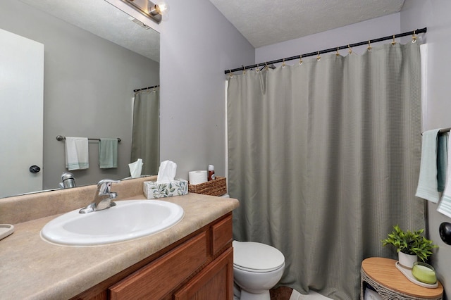 1141 N Hilton Ave, Springfield, MO 65803 - full bathroom featuring toilet, vanity, and a textured ceiling