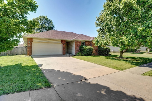 1141 N Hilton Ave, Springfield, MO 65803 - ranch-style home featuring an attached garage, concrete driveway, brick siding, and roof with shingles