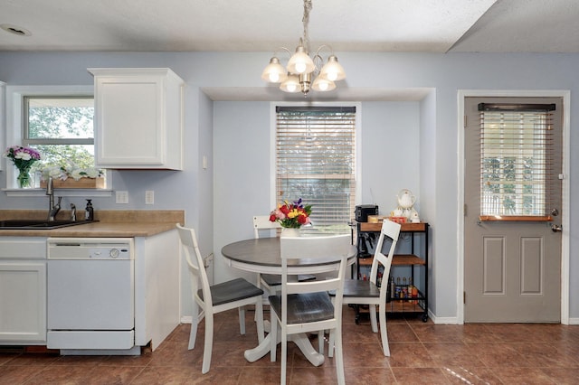 1141 N Hilton Ave, Springfield, MO 65803 - dining room with a chandelier, healthy amount of natural light, and baseboards