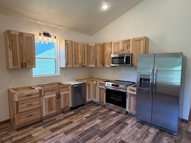 429 E S St, Mountain Grove, MO 65711 - kitchen featuring stainless steel appliances, lofted ceiling, dark wood finished floors, light brown cabinets, and light countertops