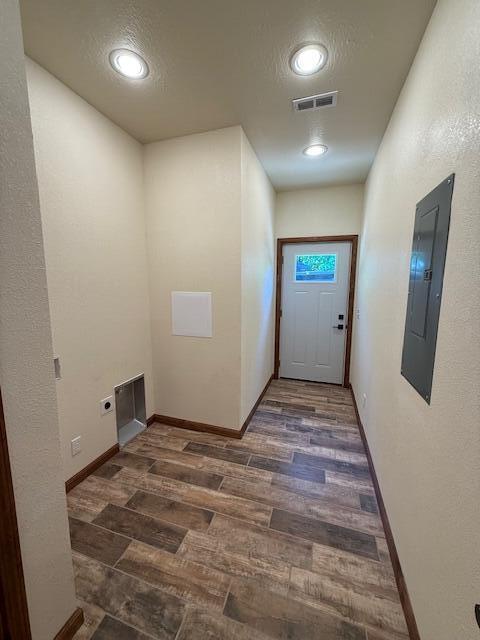 429 E S St, Mountain Grove, MO 65711 - corridor featuring electric panel, wood finished floors, baseboards, and recessed lighting
