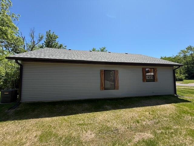 429 E S St, Mountain Grove, MO 65711 - view of side of home featuring a yard and central AC unit