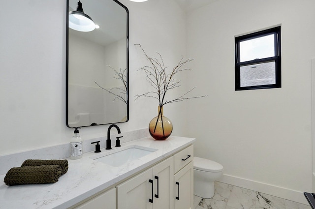 1702 E Cobblestone Dr, Ozark, MO 65721 - bathroom featuring marble look tile flooring, vanity, toilet, and baseboards