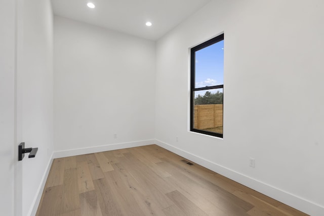 1702 E Cobblestone Dr, Ozark, MO 65721 - unfurnished room with baseboards, light wood-style floors, and recessed lighting