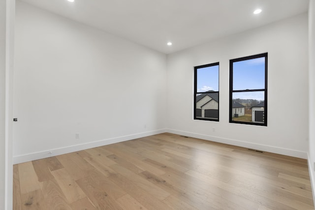 1702 E Cobblestone Dr, Ozark, MO 65721 - empty room featuring light wood finished floors, baseboards, and recessed lighting