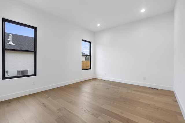 1702 E Cobblestone Dr, Ozark, MO 65721 - spare room featuring healthy amount of natural light, baseboards, light wood-type flooring, and recessed lighting