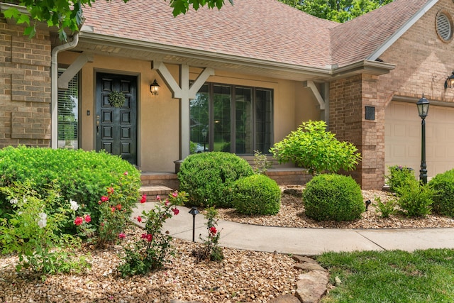 8205 Quail Ridge Ct, Nixa, MO 65714 - doorway to property featuring a shingled roof, a garage, and brick siding