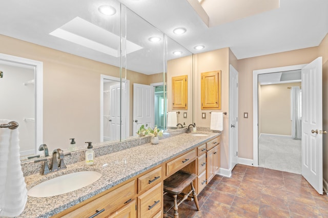 8205 Quail Ridge Ct, Nixa, MO 65714 - full bathroom with double vanity, baseboards, and recessed lighting