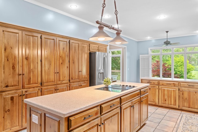 8205 Quail Ridge Ct, Nixa, MO 65714 - kitchen with stainless steel fridge, black electric cooktop, ceiling fan, plenty of natural light, and crown molding