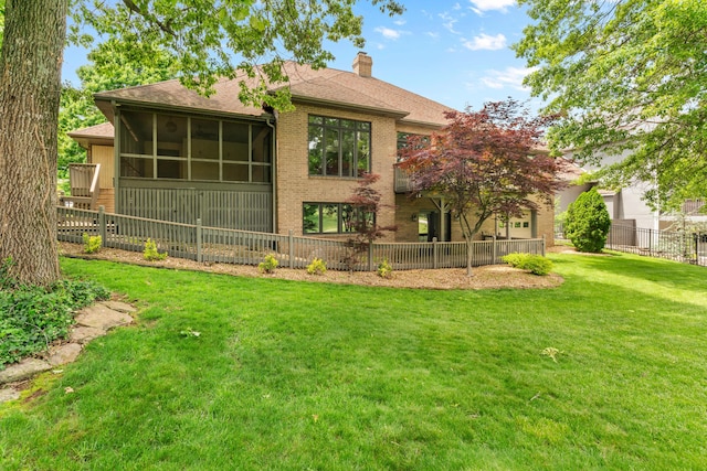8205 Quail Ridge Ct, Nixa, MO 65714 - rear view of property featuring a chimney, brick siding, a shingled roof, and a sunroom