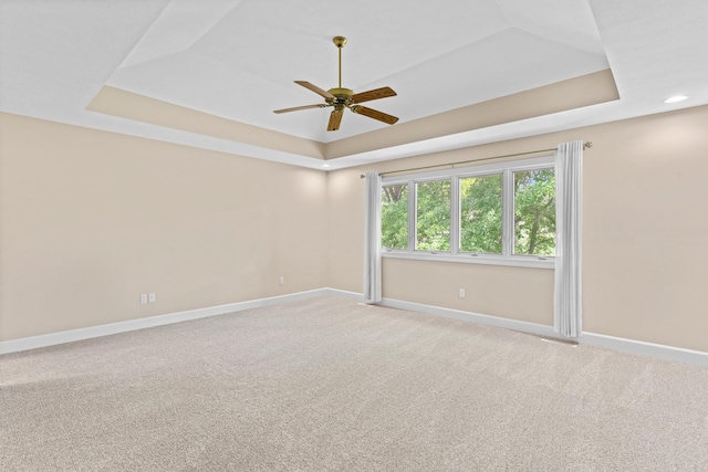 8205 Quail Ridge Ct, Nixa, MO 65714 - empty room featuring a raised ceiling, baseboards, ceiling fan, and light colored carpet