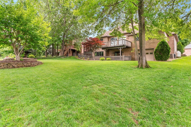 8205 Quail Ridge Ct, Nixa, MO 65714 - view of grassy yard featuring a wooden deck and a garage