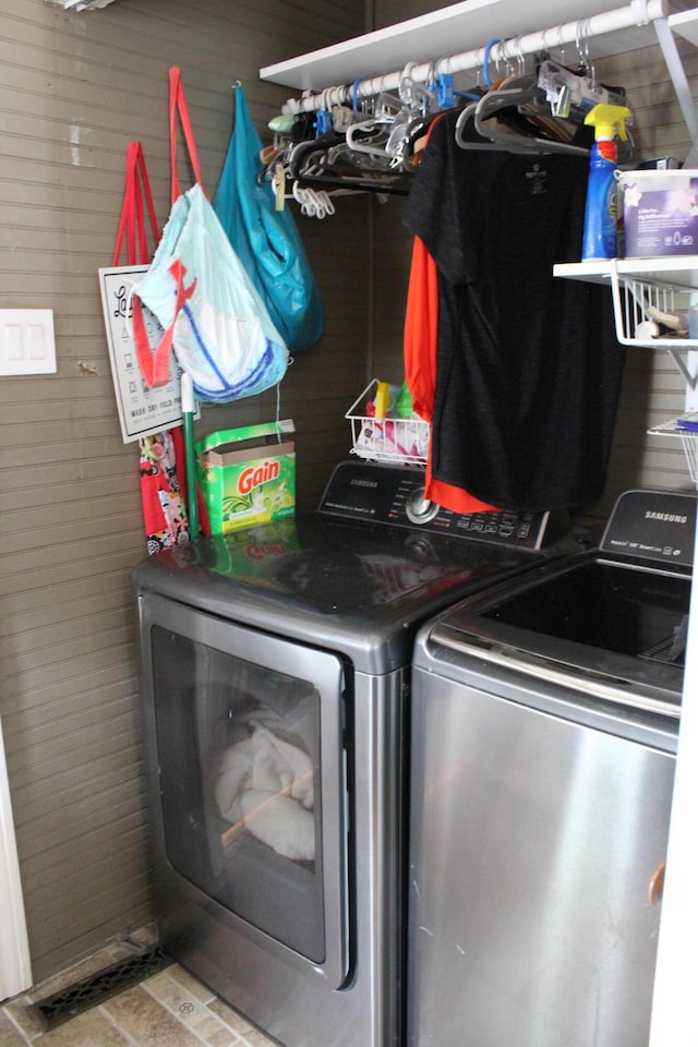 1012 E 3rd St, Monett, MO 65708 - washroom with independent washer and dryer and wood walls