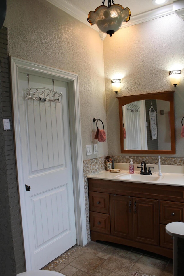 1012 E 3rd St, Monett, MO 65708 - bathroom with ornamental molding and vanity