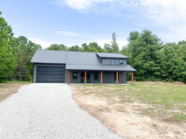 000 Reid Dr, Theodosia, MO 65761 - modern inspired farmhouse featuring gravel driveway, a garage, metal roof, and a porch