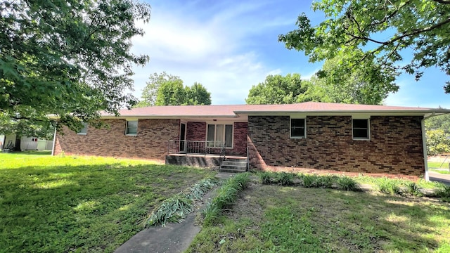123 E 4th St, Freistatt, MO 65654 - ranch-style house with brick siding and a front lawn