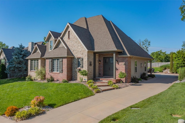 853 E Grafton Dr, Nixa, MO 65714 - view of front facade featuring brick siding and roof with shingles