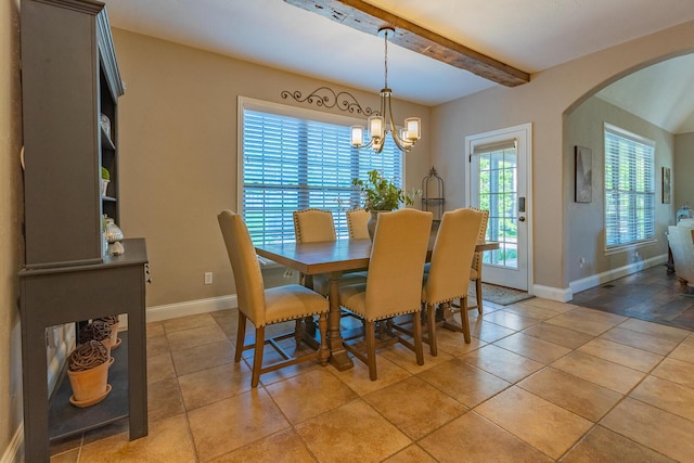 853 E Grafton Dr, Nixa, MO 65714 - dining space featuring arched walkways, baseboards, a chandelier, beam ceiling, and light tile patterned flooring