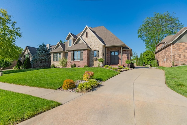 853 E Grafton Dr, Nixa, MO 65714 - view of front of home with brick siding and a front yard