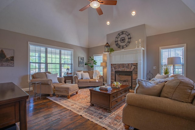 853 E Grafton Dr, Nixa, MO 65714 - living room with a ceiling fan, dark wood-style floors, healthy amount of natural light, a fireplace, and high vaulted ceiling