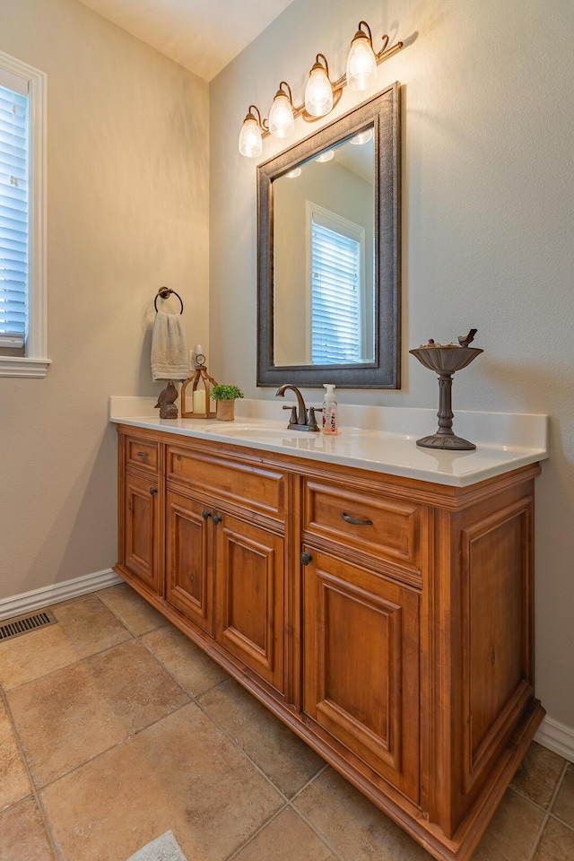853 E Grafton Dr, Nixa, MO 65714 - bathroom featuring vanity and baseboards